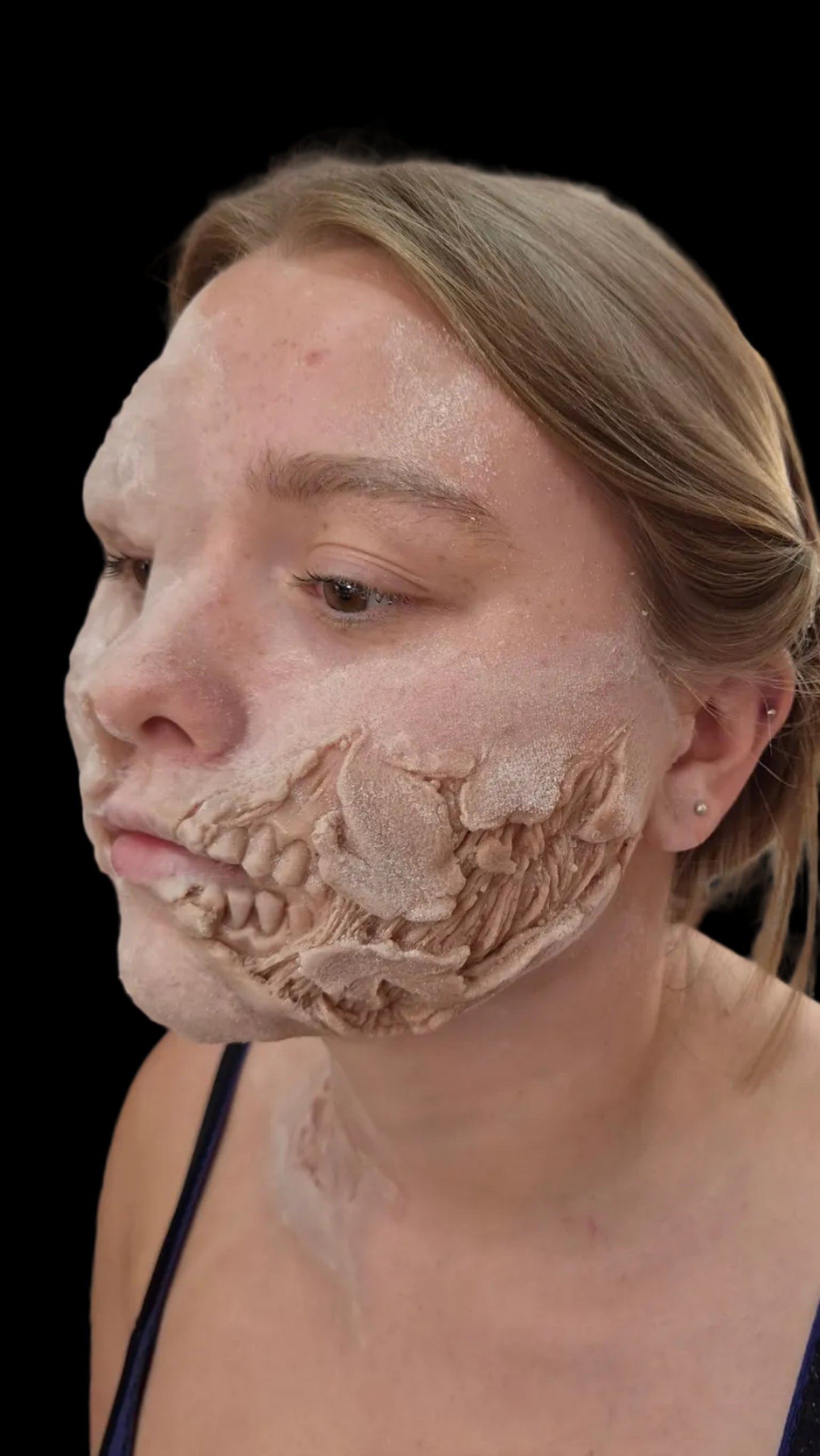 Exposed teeth zombie rot prosthetic appliance for realistic Halloween, film, TV and special effects zombie makeup.