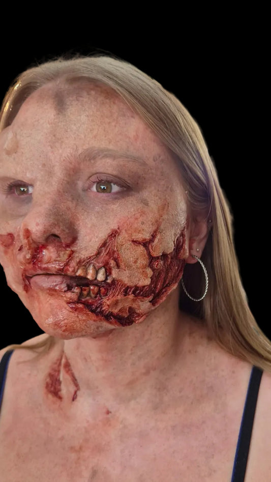 Exposed teeth zombie rot prosthetic appliance for realistic Halloween, film, TV and special effects zombie makeup.